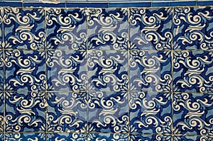 Blue floral pattern hand-painted in baroque style on ceramic tiles