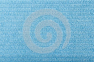 Blue flossy towel texture close up. Fluffy fabric with horizontal stripes. photo