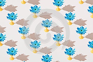 Blue flower on a yellow plastic carrier. Minimal template