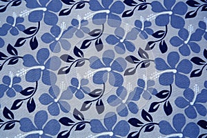 Blue flowers on textil background photo