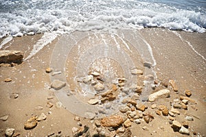 Blue foam waves on sea beach