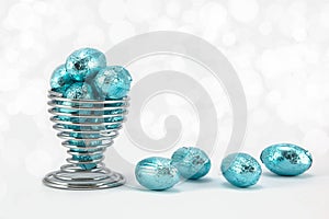 Blue foil wrapped Easter eggs.