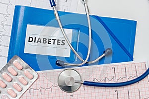 Blue folder with Diabetes diagnosis and stethoscope photo