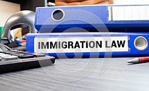 Blue folder with the label Immigration Law