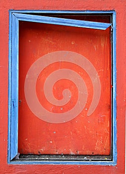 Blue frame on a boarded window