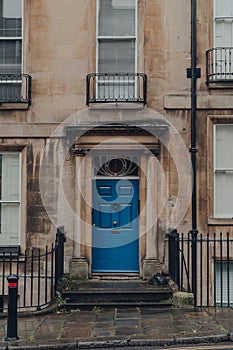 Blue front door on a traditional limestone house in Bath, UK