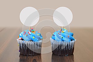 Blue Frosted Cupcake Mockup with Round White Toppers in Modern Kitchen Scene