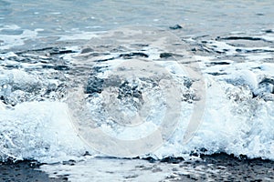 Blue frothing wave of the sea. Background closeup