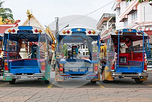 Blue funny rickshaws tuk tuk lined up