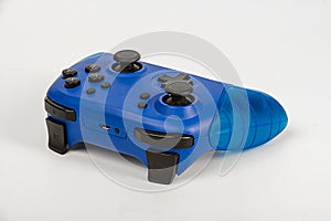 Blue game controller for playstation on a white background.