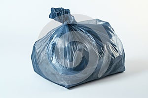 Blue garbage bag on white surface