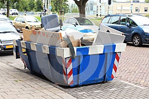 Blue Garbage Dumpster