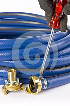 A blue garden hose with coupling