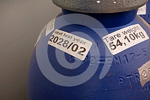 Blue gas cylinders in warehouse storage