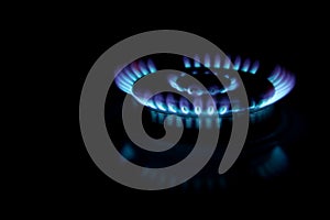 Blue gas flame. Gas crisis in Europe. Rising gas prices. Fuel energy. Russian gas. Blurred background for banner and media