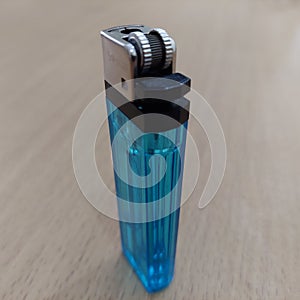Blue gas lighter that is refillable and easy to carry