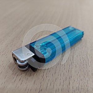 Blue gas lighter that is refillable and easy to carry