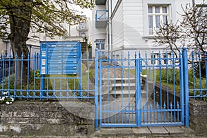 Blue gate barring the entrance
