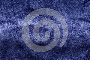Blue genuine leather texture, blue genuine leather background, close-up shot.