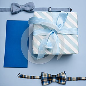Blue gift box, blue gift envelope and two bow tie