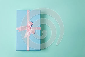 Blue gift box on pink background
