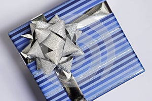 Blue gift box with silver ribbon
