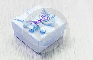 Blue gift box on table wood