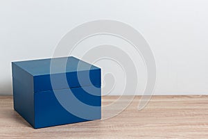 Blue gift box on wooden table background