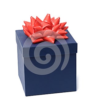 Blue gift cardboard box and red bow on top on white background. Gift and surprise