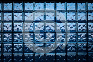 Blue glass brick wall - seamless texture. color abstraction in brick glass wall