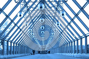 Blue glass corridor in bridge