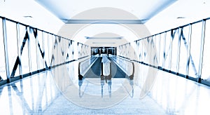 Blue glass corridor in office centre