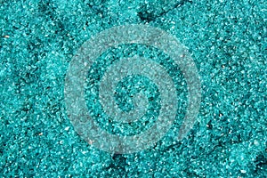 Blue glass cullet and small bits as background