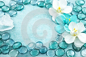 Blue glass drops aqua with white flowers orchid and bar of sea s