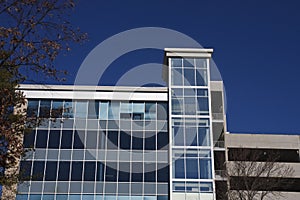 Blue Glass Office Building Under Deep Blue Sky