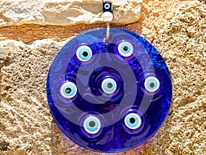 blue glass ornament circle souvenir with eye-shaped amulets - Nazar boncuk