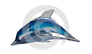 Blue glass porpoise on white table