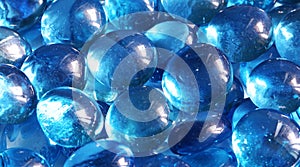 Blue glass spheres background. Closeup macro abstract