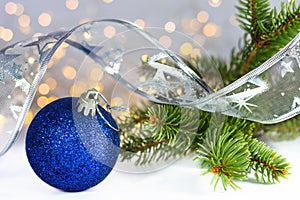 Blue glitter christmas balls and silver ribbon