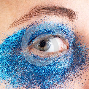 Blue glitter macro eye make-up creative