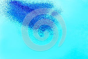 Blue glitter shiny background in the cporner sunshine space for text