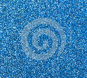Blue glitter texture close-up as a background.