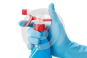 Blue gloved hand with cleaning spray bottle photo