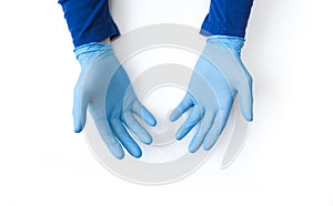 Blue gloved hands close up on white background. Call for hand disinfection. Stop coronavirus concept. Using