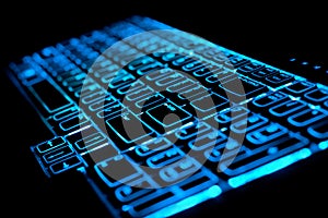 Blue glowing computer laptop keyboard