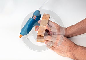 Blue glue gun with a man hands