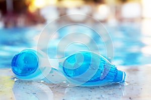 Blue goggles by the pool