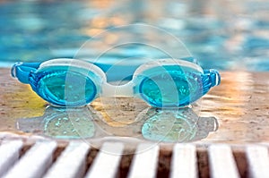 Blue goggles by the pool