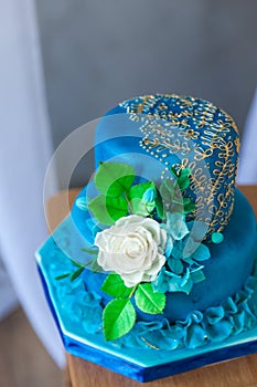 Blue and gold birthday or wedding cake