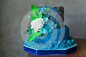 Blue and gold birthday or wedding cake